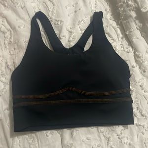 wilo lightly padded sports bra. black with brown threading size small